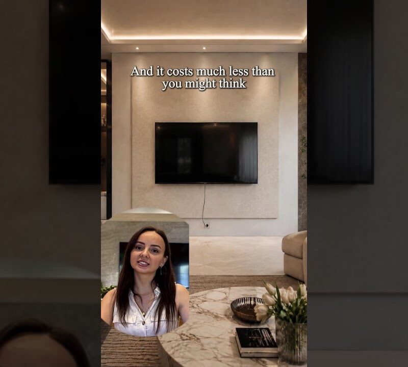 Sleek TV Wall Decor Idea: Floating Shelves, Warm Lighting & Minimalist Accents